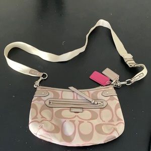 This is a coach purse , it’s pink and tan
